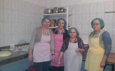 Wives of four martyrs support their families wit with their work in a small kitchen